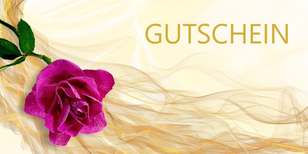 Eine edle Gutscheinkarte mit goldenem Hintergrund, dem Schriftzug Gutschein und einer pinkfarbenen Rose.